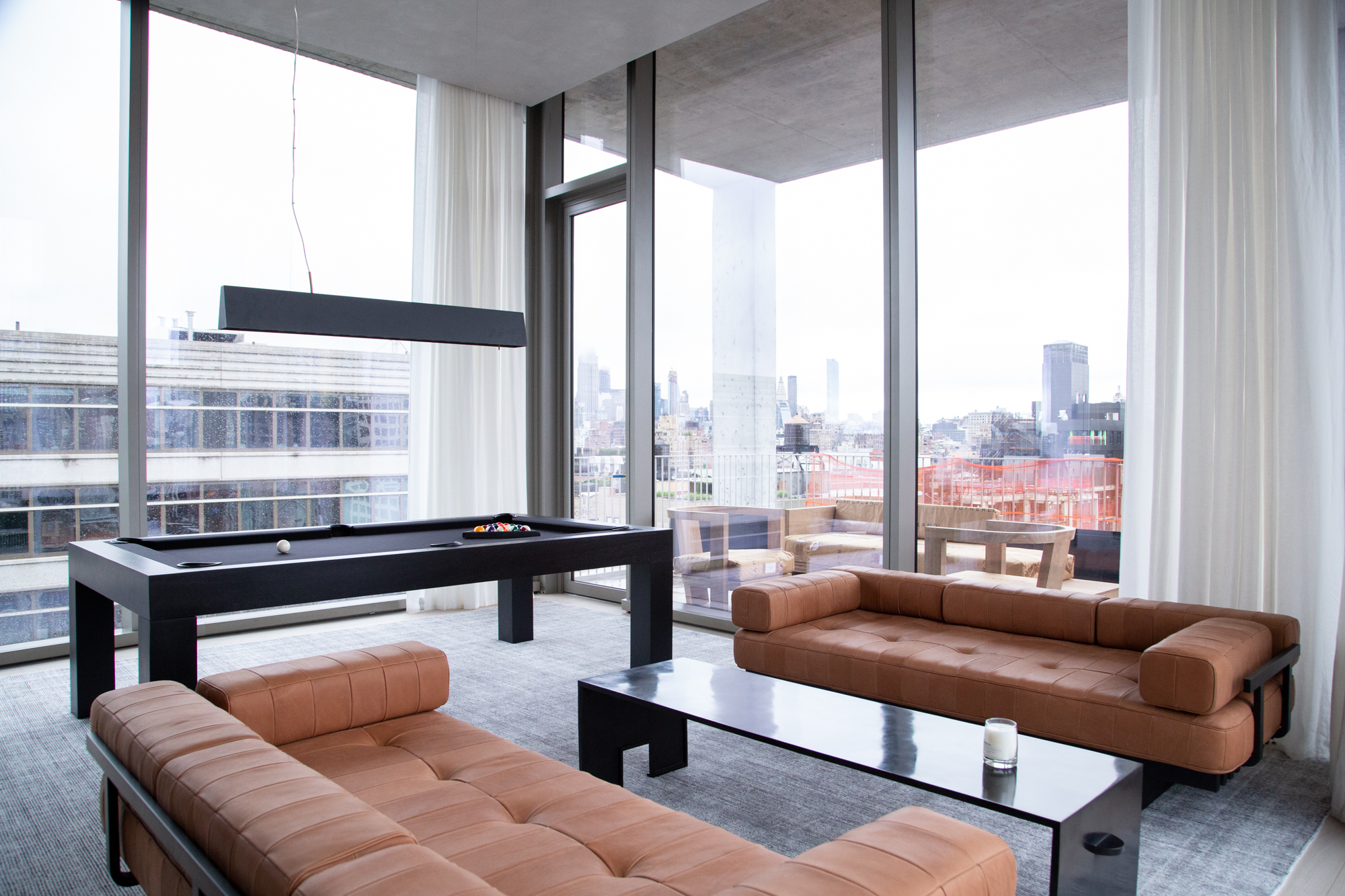 Warm luxury interior detail with refined furniture and architectural finishes.
